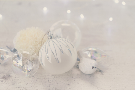White winter christmas scene with set of glass ball and bird decorations, retro tonedの写真素材