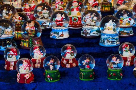 Christmas market kiosk details - snawball with snowman, santa claus and housesの写真素材