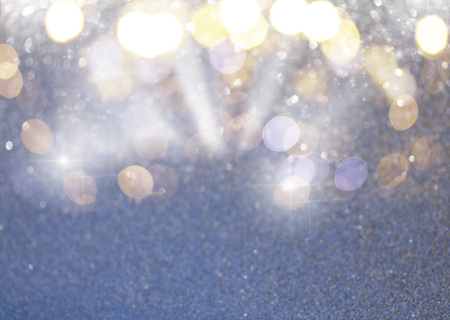 Christmas holiday glittering defocused gray background with soft bokeh lightsの写真素材