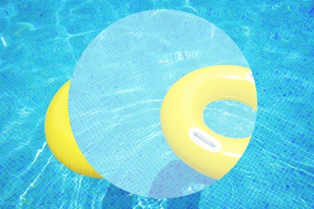 rubber ring floating in transparent blue tiled pool abstract summer background