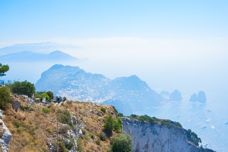 Capri landscape and Faraglioni cliffs and Tyrrhenian Sea blue water, Capri island, Italyの写真素材