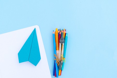 Back to school styled scene with school supplies on blue backgroundの写真素材