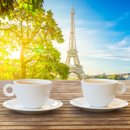 two cups of coffee with view of Eiffel Tower landmark from Trocadero at sunrise, Paris, Franceの写真素材