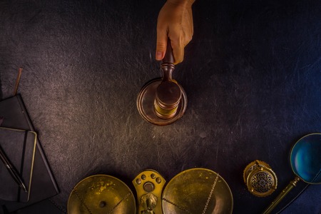 Hand holding law gavel - law and justice concept, retro tonedの写真素材