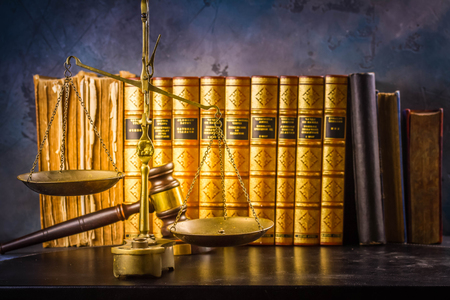Law and justice concept - law gavel and scale with row of books, retro tonedの写真素材