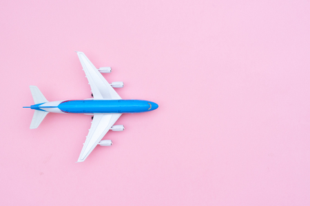 Plane on pink background with copy spaceの写真素材