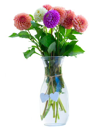 Dahlia mixed fall flowers bouquet in vase isolated on white backgroundの写真素材
