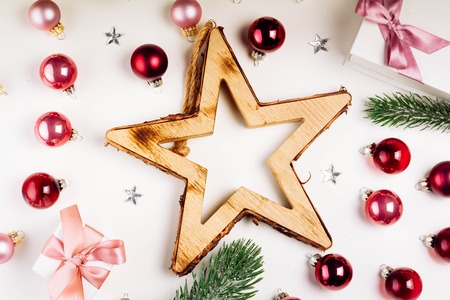 Christmas flat lay scene with star, pink and violet glass balls and gift boxes, retro tonedの写真素材
