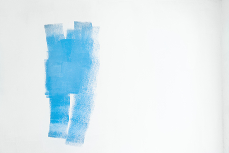 House renovation background of white wall with blue paint stainsの写真素材