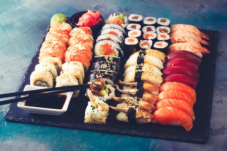 Japanese sushi big set with pair of black chopsticks, tonedの写真素材