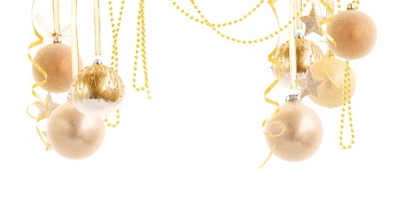 Hnaging golden christmas balls and garlands isolated on white backgroundの写真素材