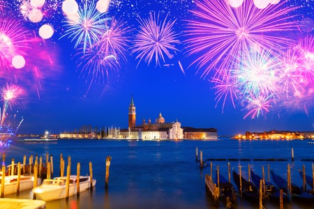 View of San Giorgio island at night with fireworks, Venice, Italyの写真素材