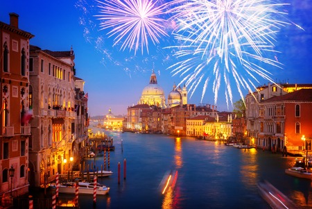 Grand canal and Basilica Santa Maria della Salute at night with fireworks, Venice, Italy, tonedの写真素材
