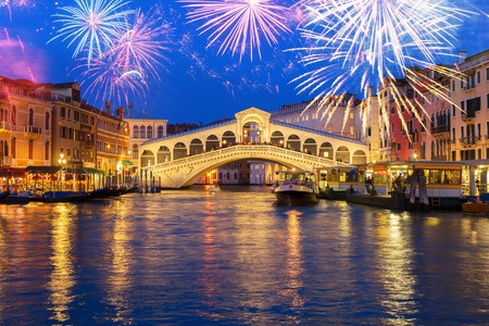 View of famous Rialto bridge at night with fireworks, Venice, Italyの写真素材