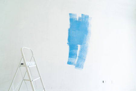 home renovation concept - old flat during restoration or refurbishment with blue paint stainsの写真素材