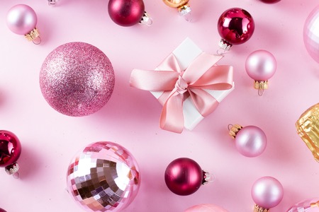 Christmas pink balls with gift box on pinkの写真素材