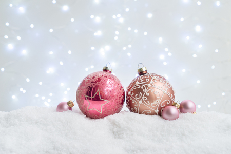 White christmas with snow - pink balls with festive lightsの写真素材
