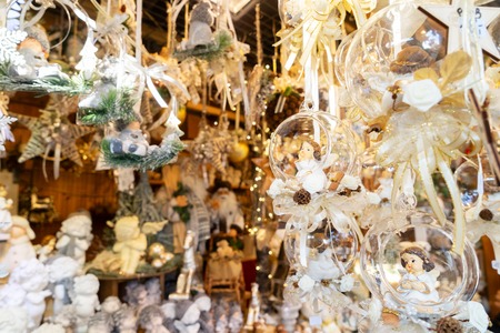 Christmas market kiosk details with hanging christmas tree decorations with angelsの写真素材