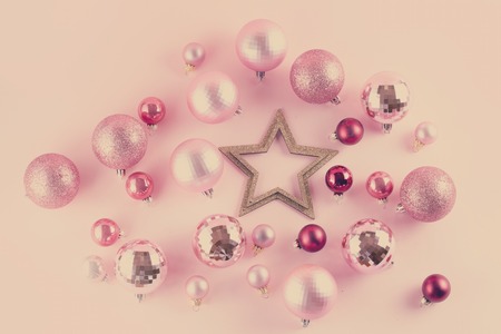 Christmas decorations with golden star on pink background, retro tonedの写真素材
