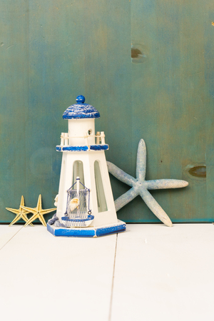 Summer sea still life with lighthouse, copy space on white backgroundの写真素材