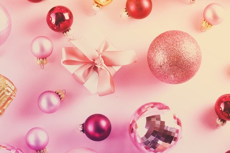 Christmas pink balls with gift box on pinkの写真素材