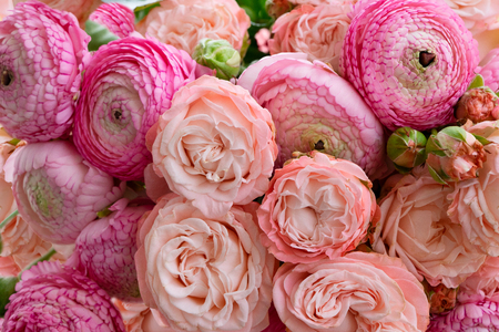 Flowers composition. Floral texture made of roses and ranunculus flowers . Flat lay, top viewの写真素材