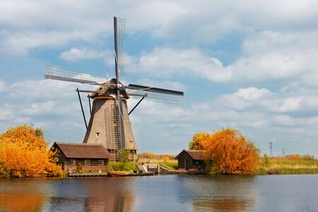 row of traditional dutch windmills at Kinderdijk at fall day, Netherland