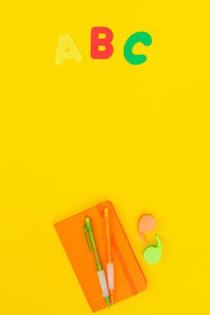 Back to school styled scene with abc letters on yellowの写真素材