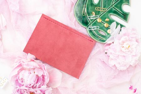 Creative wedding composition with wedding invitation mock up, pink blanket, flowers, eucalyptus...