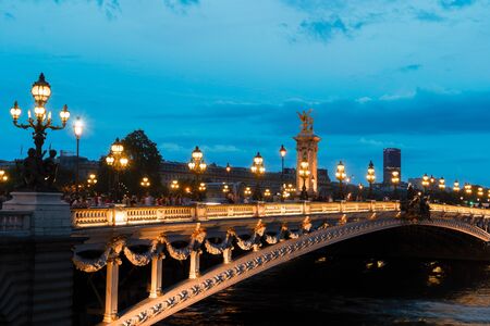 Paris at night - famouse Alexandre III Bridge illuminated at blue night, Paris, Franceの写真素材