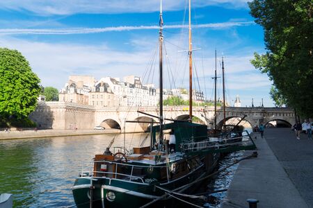 bridge Pont Neuf and Seine river with moored boats and yachts, Paris, Franceの写真素材