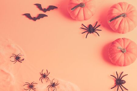 Halloween flat lay top view frame on bright orange background with copy space, retro tonedの写真素材
