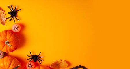 Halloween flat lay scene on orange  with copy spaceの写真素材