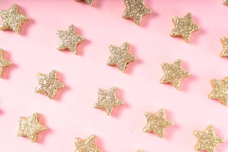 Christmas flat lay scene with golden strar decorations, top view