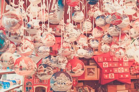 Christmas market kiosk - traditional hanging festive christmas tree decorations, retro tonedの写真素材