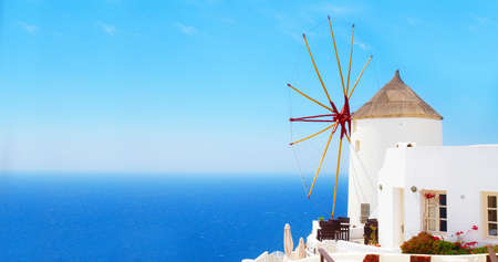 windmill of Oia at sunny day close up, Santorini, web banner formatの写真素材