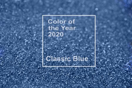 Abstract classic blue glitter bokeh and scattered sparkles