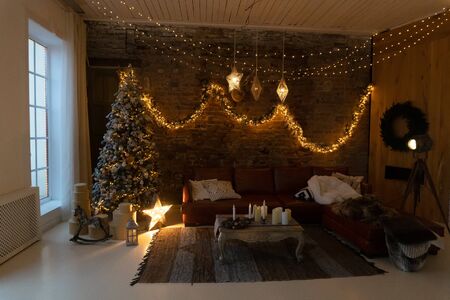 Home decorated for Christmas holidays with burning lightsの写真素材