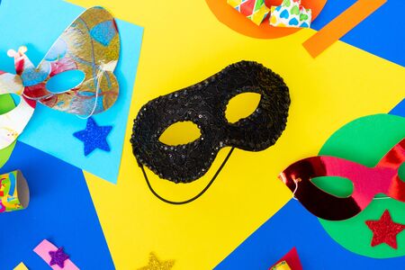 Carnival flat lay background, masks on modern colorful background