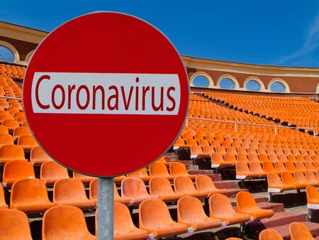 cancellation of sport venues due coronavirus concept, epmty stadium seats in backgroundの写真素材
