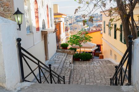small cosy street with steep stairs of famous Placa district in Athens, Greeceの写真素材