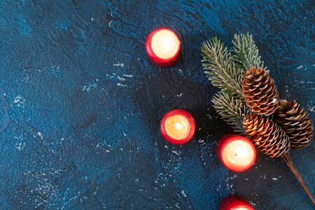 Christmas flat lay scene with advent candles, Christmas celebration concept, copy space on classic blue backgroundの写真素材