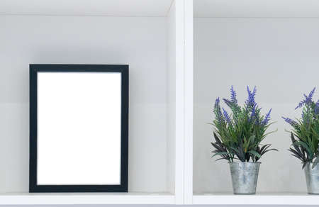 Frame mock up in modern home on white shelf