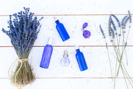 Lavender flowers and lavender oil and products in blue bottles