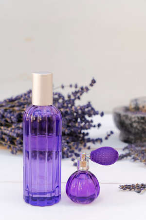 Lavender flowers and lavender oil in the bottlesの写真素材
