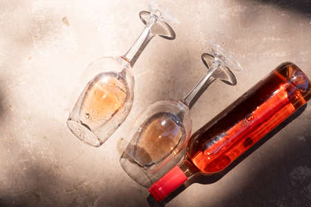 pink wine in glasses and bottle, top viewの写真素材