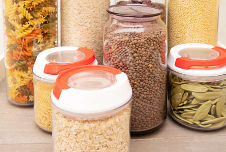 Food storage - raw food ingredients inside transparent jars close upの写真素材