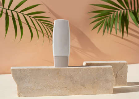 Minimal modern cosmetic products display with one tube on beige background with shadow overlay