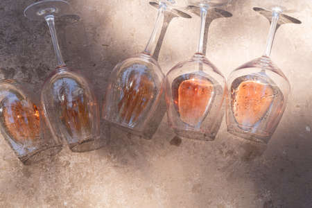 pink wine in glasses, top view row, wine testing concept, shadows overlay