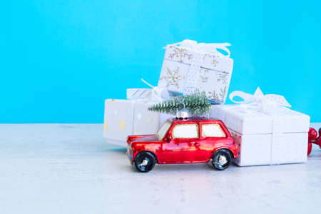 Christmas scene with pile of wrapped gifts on aqua blue background